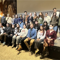 group of students, faculty, and staff with speaker