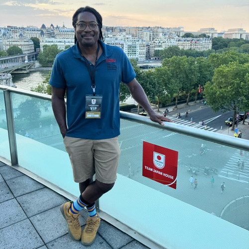 man stands on balcony