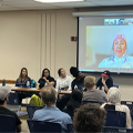 panel speaks in front of audience
