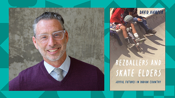 man smiling next to book cover with skateboarders