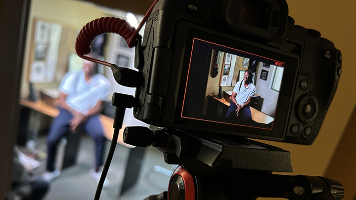 video camera with man in being filmed