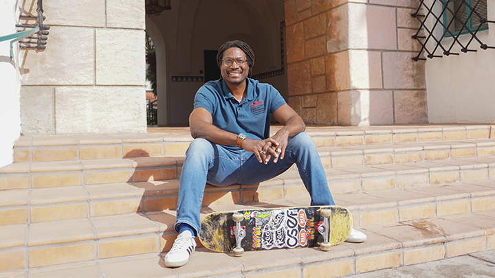 man site with skateboard on SDSU campus