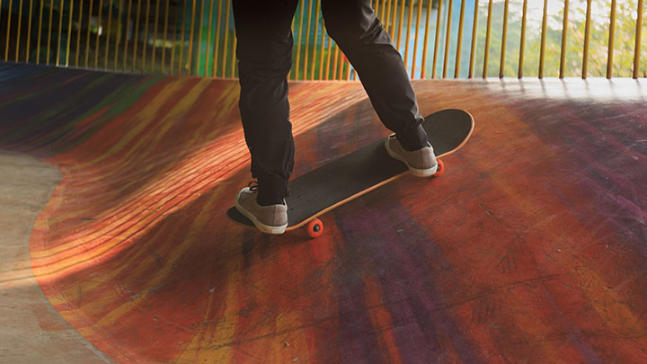 pair of feet on skateboard